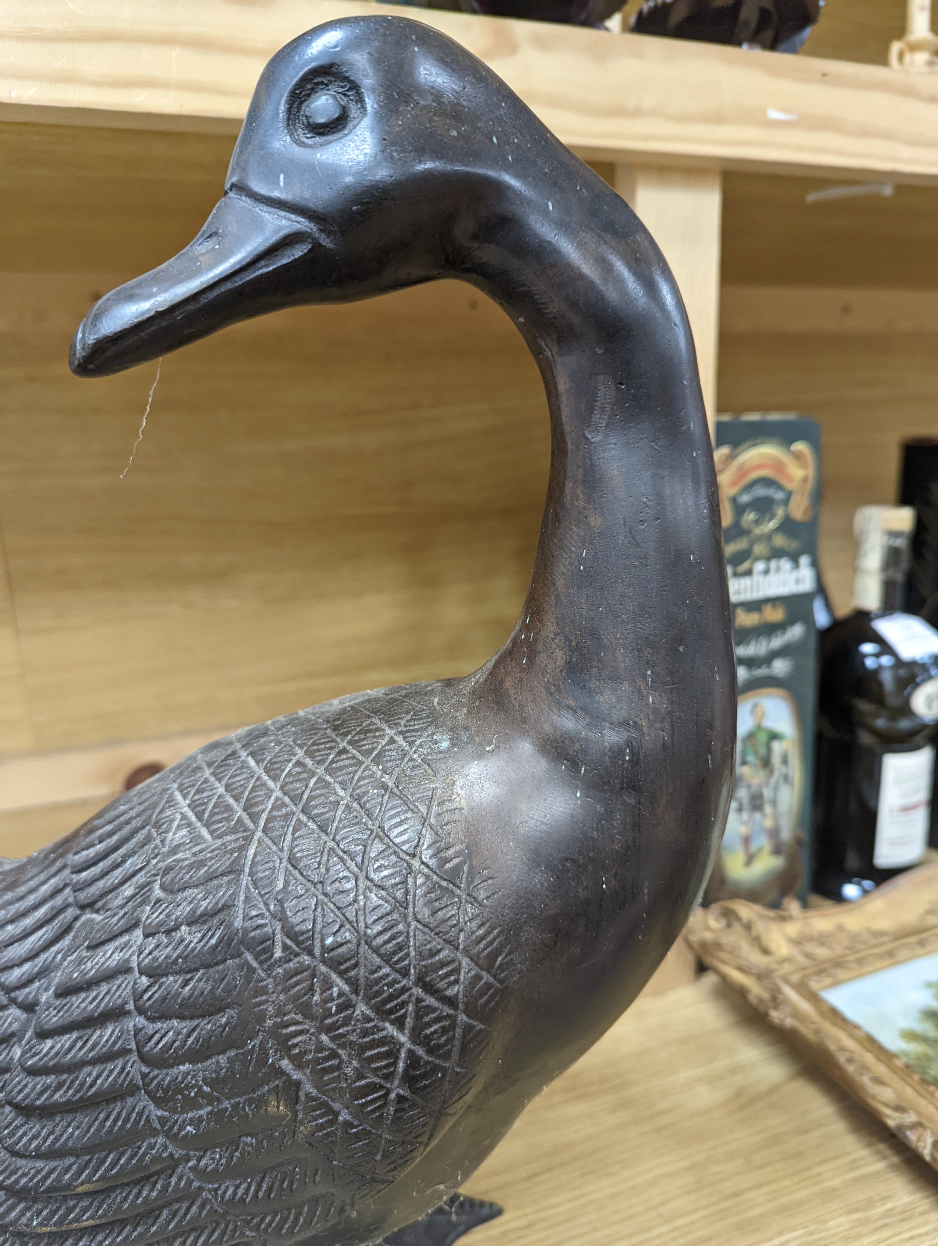 A pair of modern Chinese bronze models of geese, largest 48cm